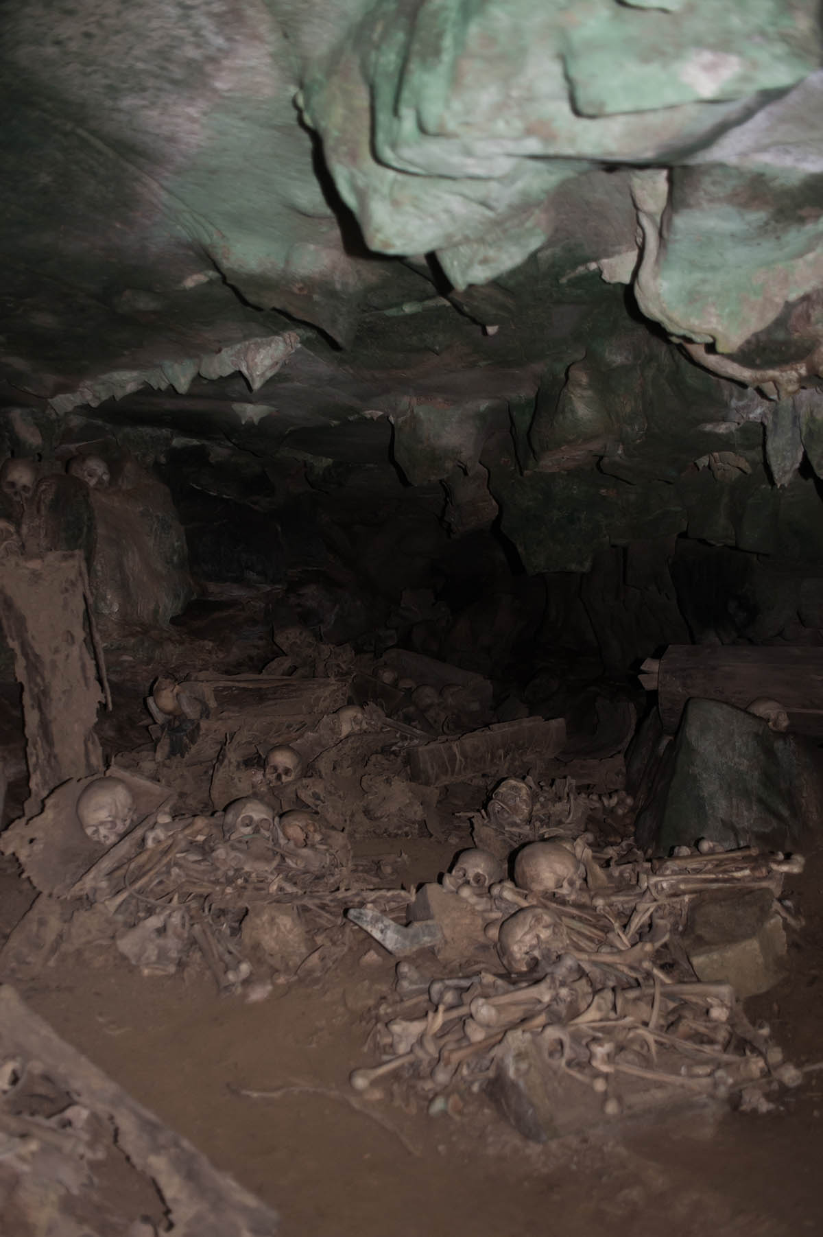 Skulls and coffins in burial caves, Tana Toraja, Sulawesi