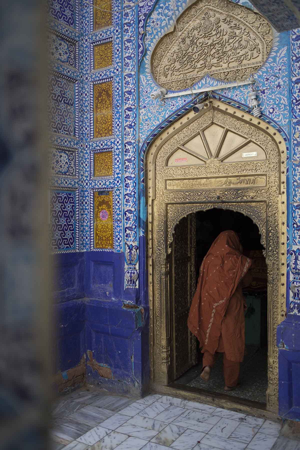 A woman entering the Shrine of Sachal Sarmast